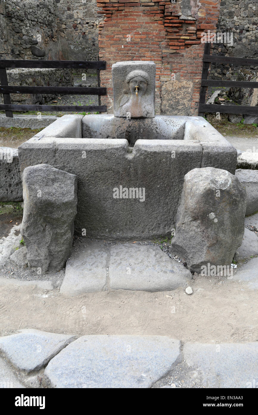 Public drinking water fountain on Via Stabiana, Pompeii, Italy Stock