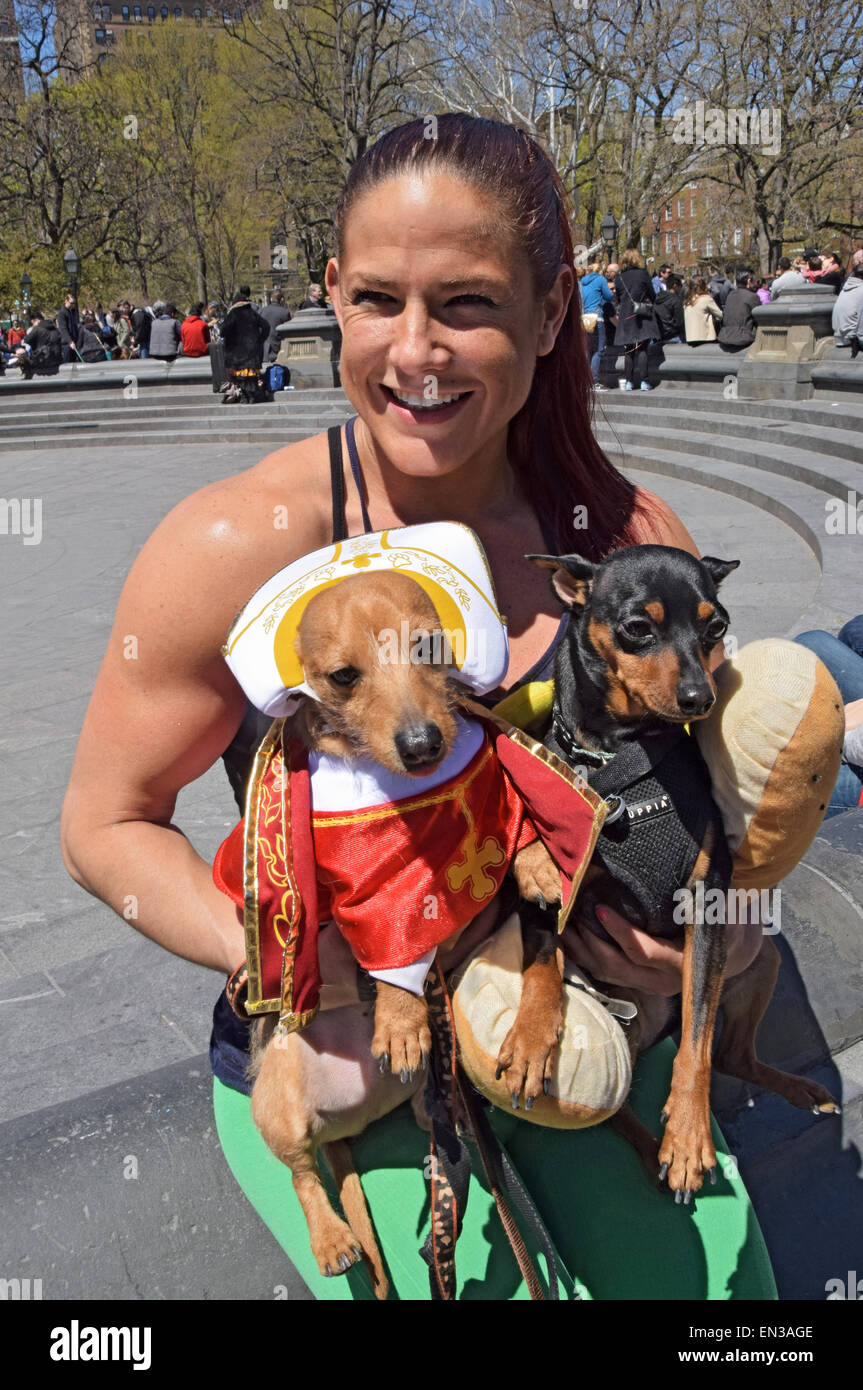 Portrait of a muscular lady her costumed dogs at Dachshund day