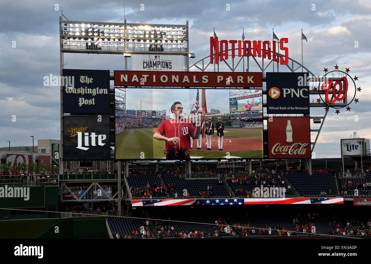An image on the scoreboard at Nationals Park of violinist Glenn Donnellen playing the anthem on a bat shaped electric violin. Stock Photo