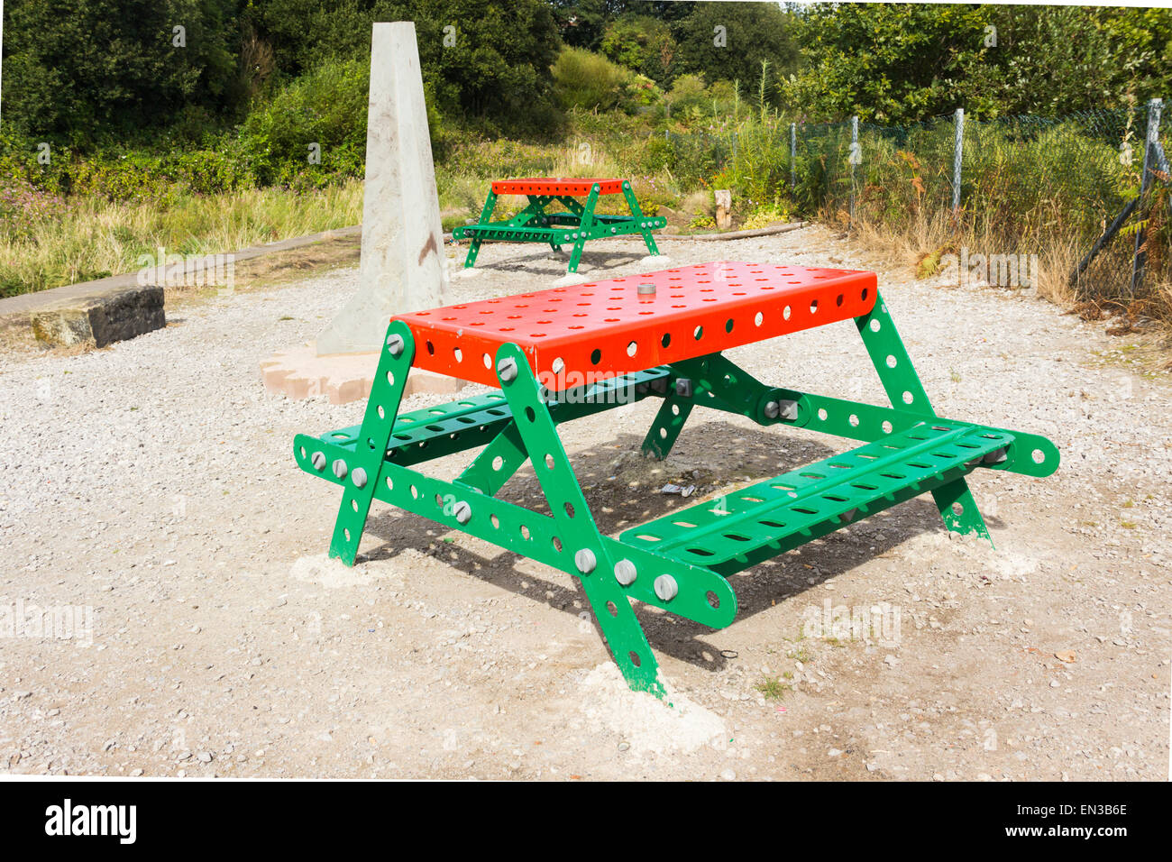 Giant Meccano picnic tables on the bank of the yet-to-be restored Manchester-Bolton-Bury canal at Nob Inn, Little Lever, Bolton. Stock Photo