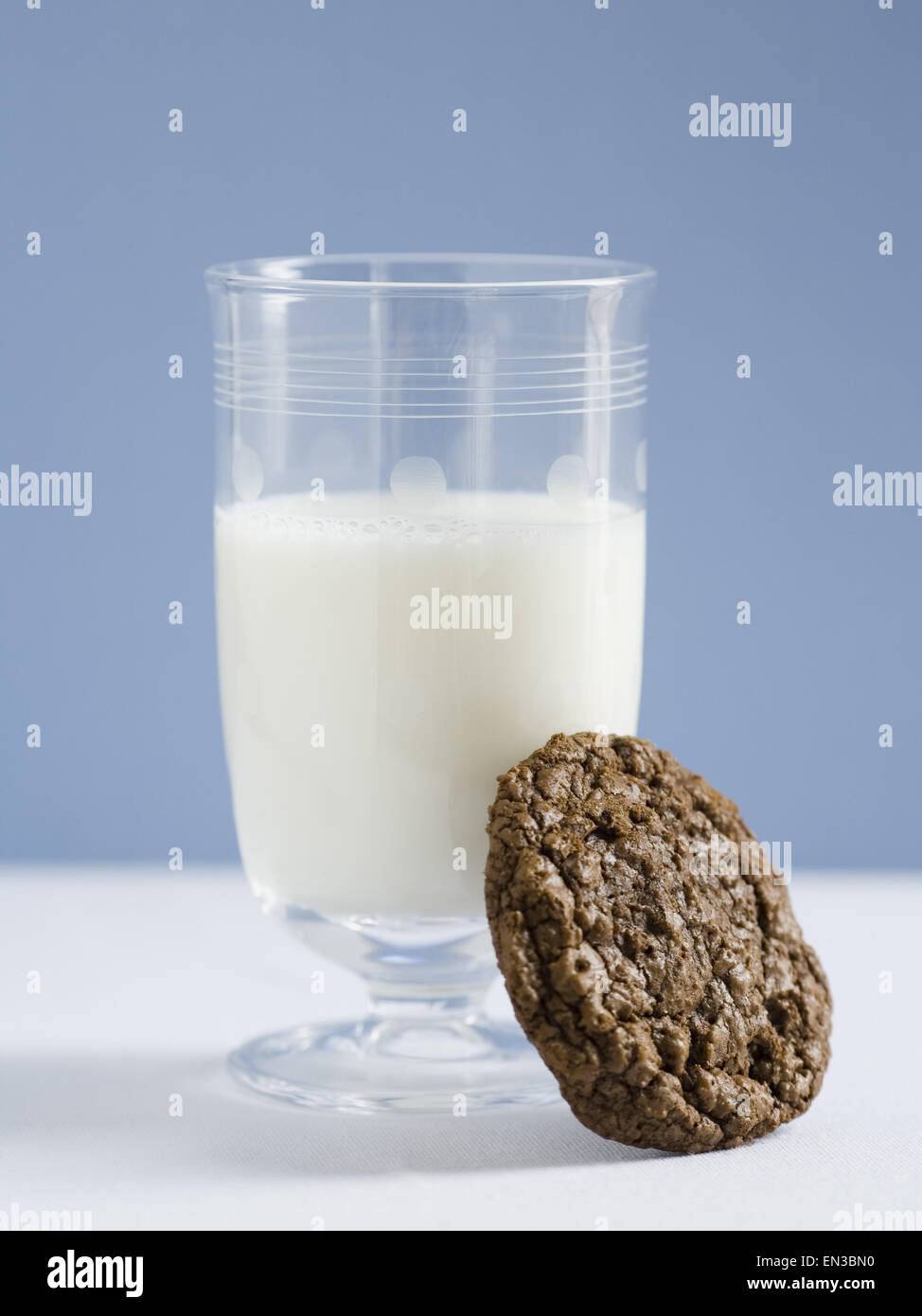 Glass of milk with chocolate cookie Stock Photo