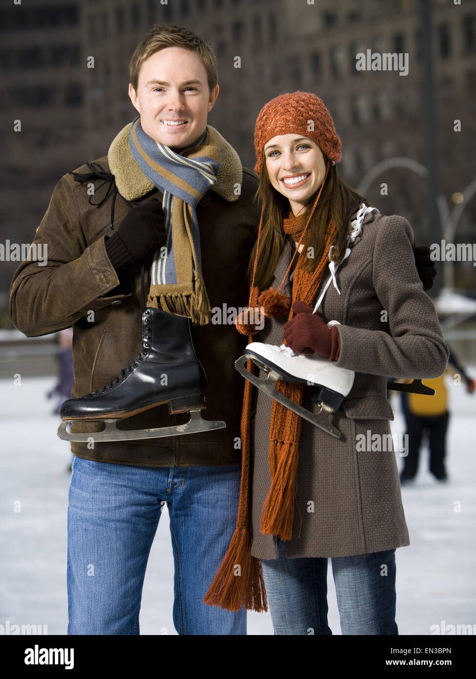 Couple with skates outdoors in winter Stock Photo
