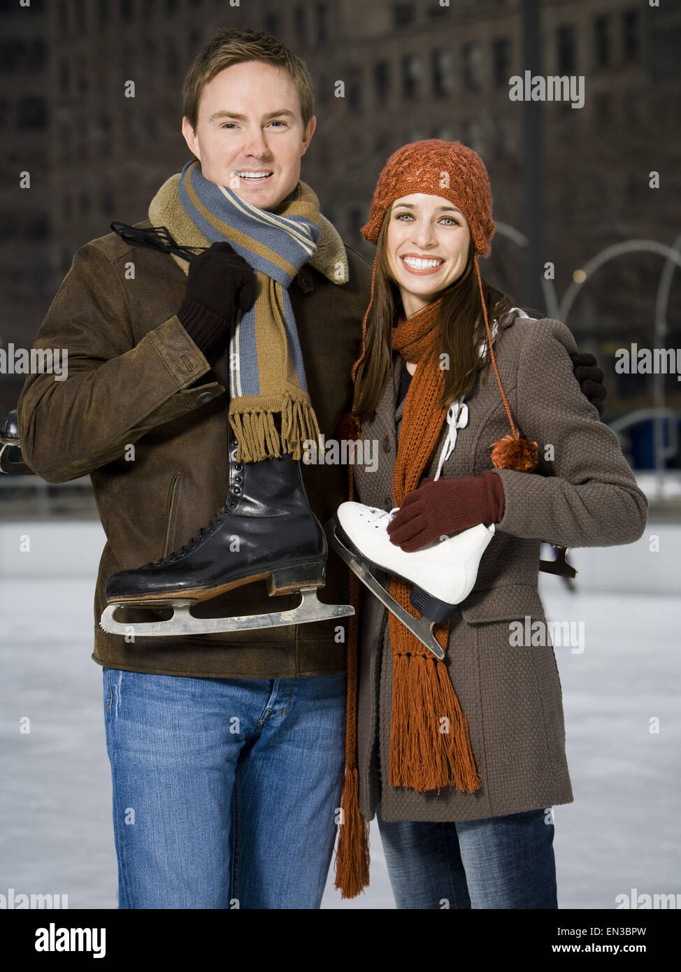 Couple with skates outdoors in winter Stock Photo