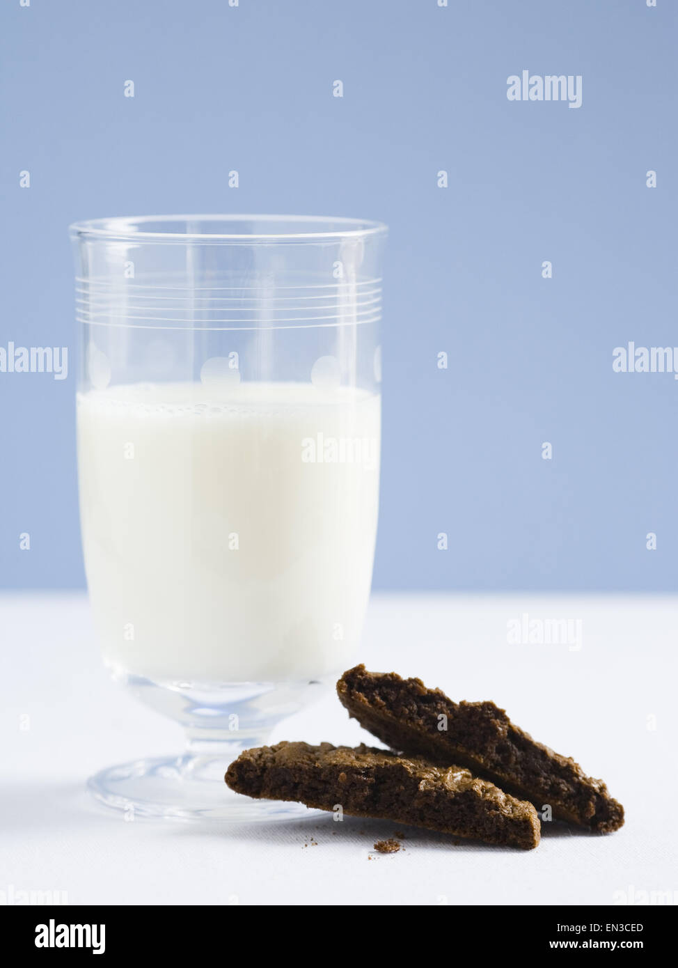 Glass of milk with chocolate cookie Stock Photo