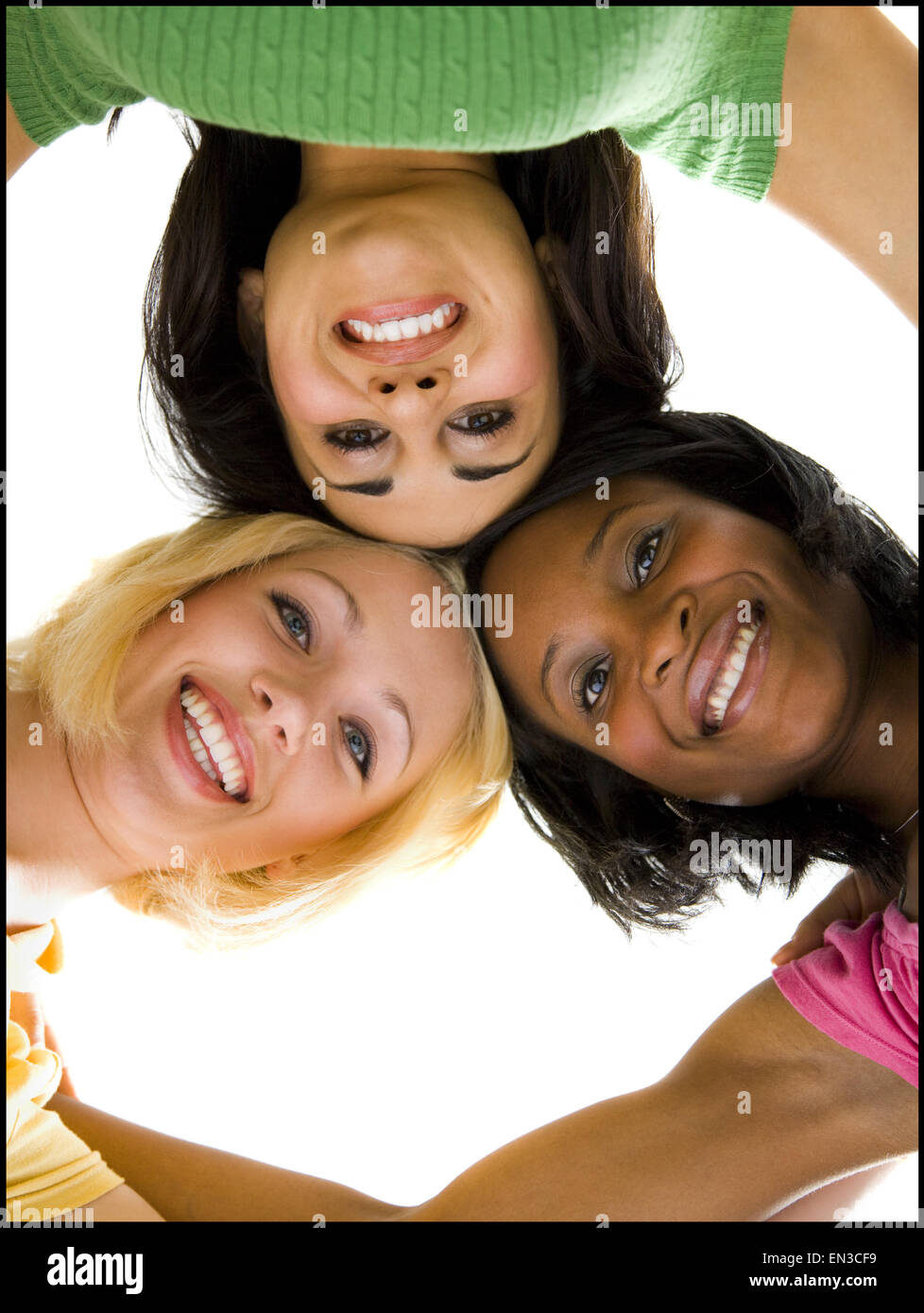 Three women facing camera hi-res stock photography and images - Alamy