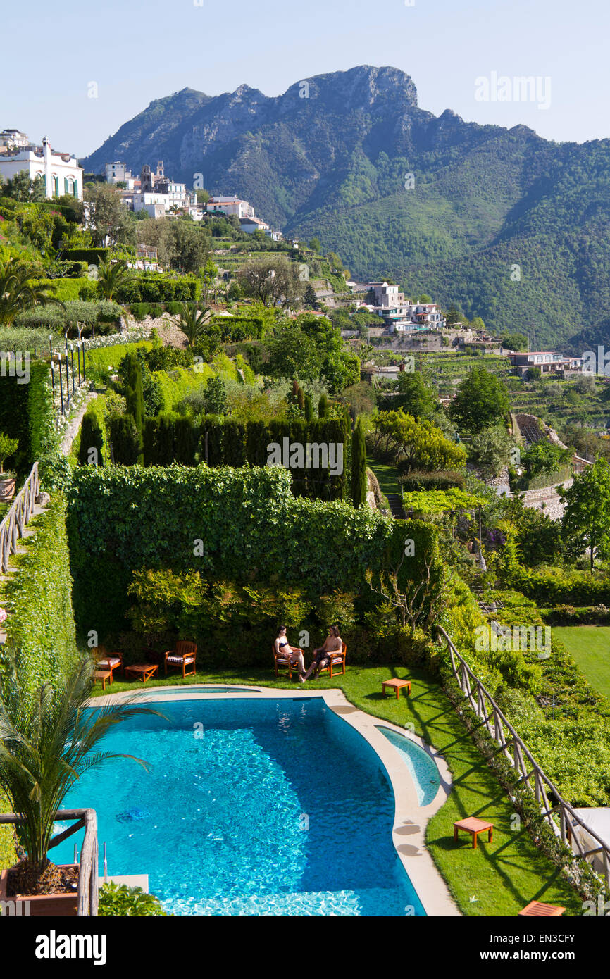 Italy, Ravello, Terrace with outdoor pool and couple Stock Photo