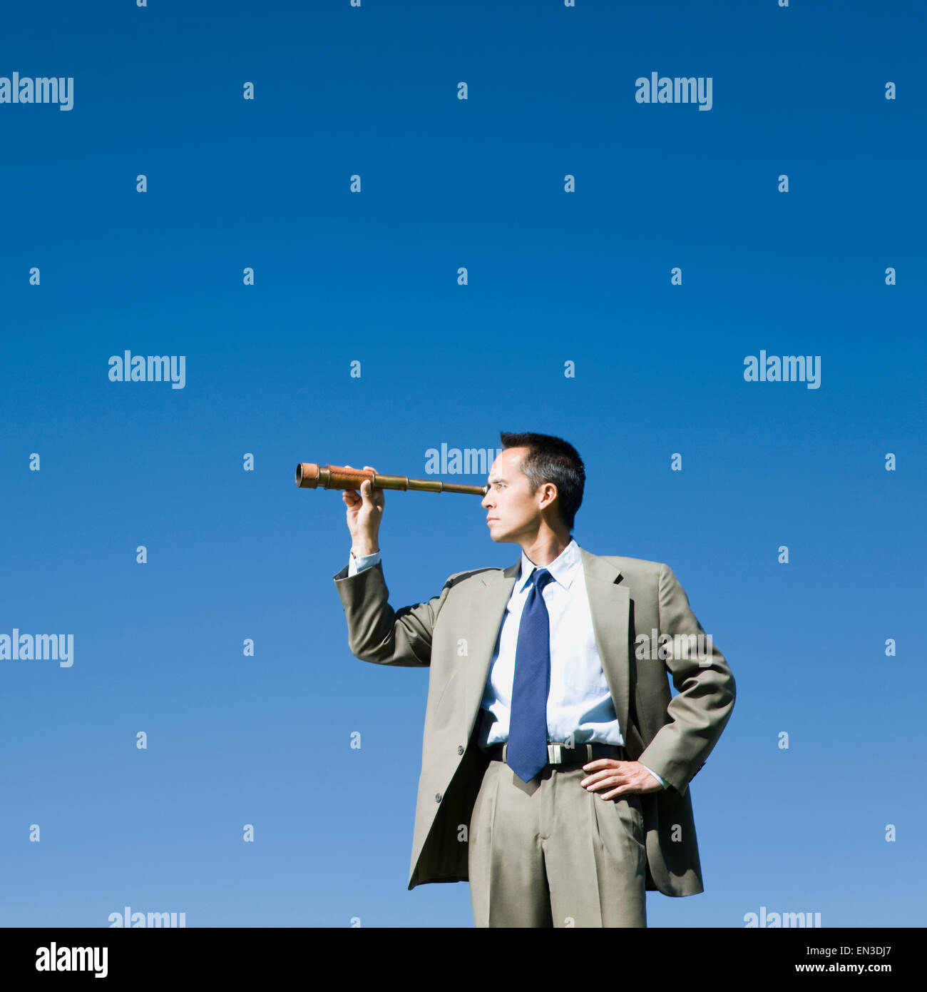 businessman using a spyglass telescope Stock Photo