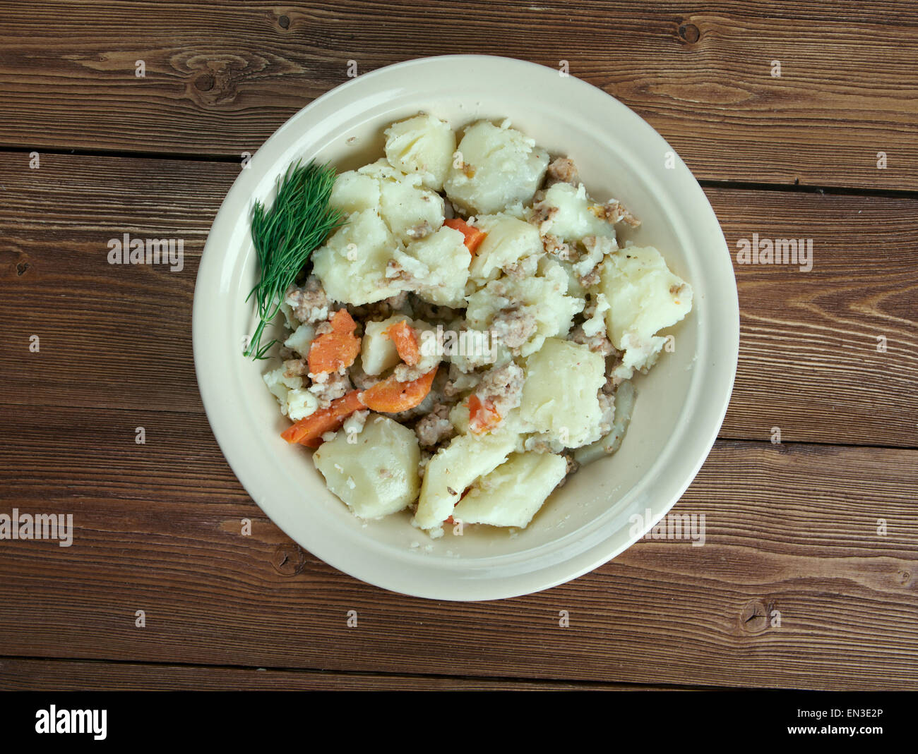 Stovies - Scottish dish based on potatoes.contains potatoes with, variously, onions, carrots, other vegetables,  minced beef . Stock Photo