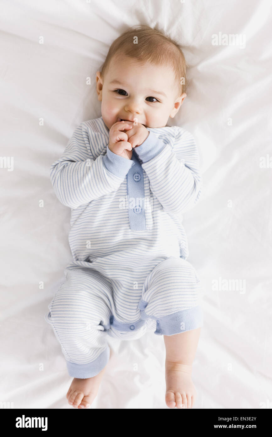 Baby girl lying down hi-res stock photography and images - Alamy