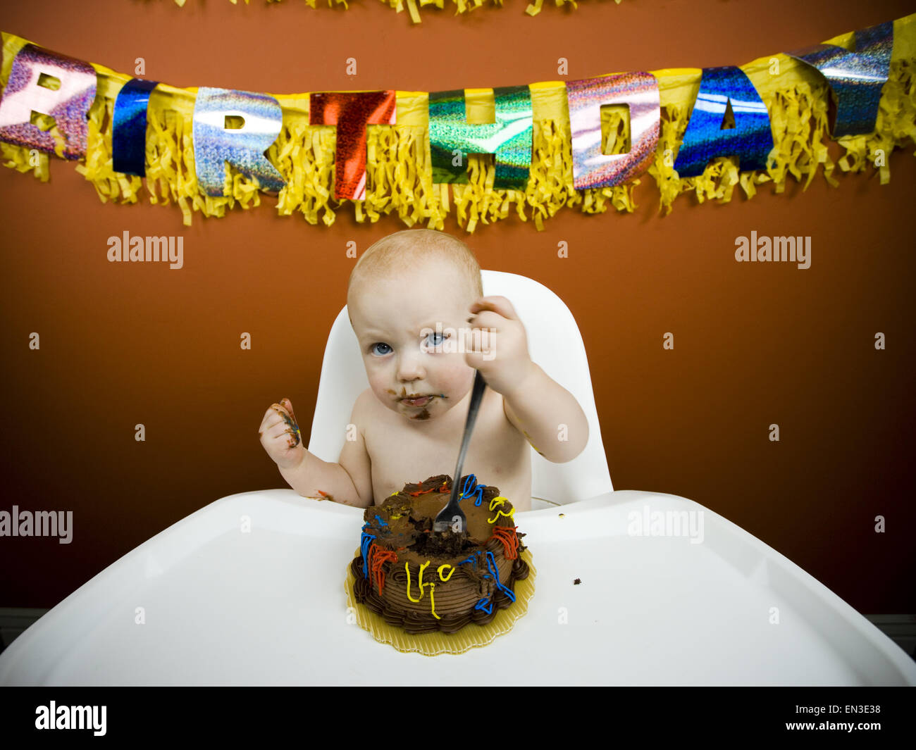Baby eating birthday cake Stock Photo