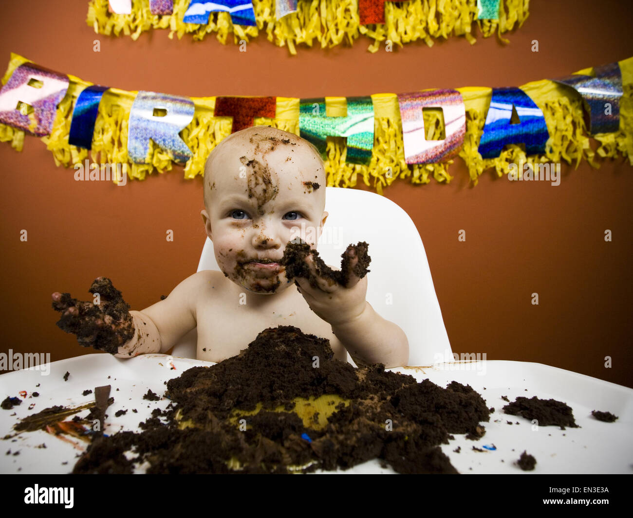 Baby eating birthday cake Stock Photo