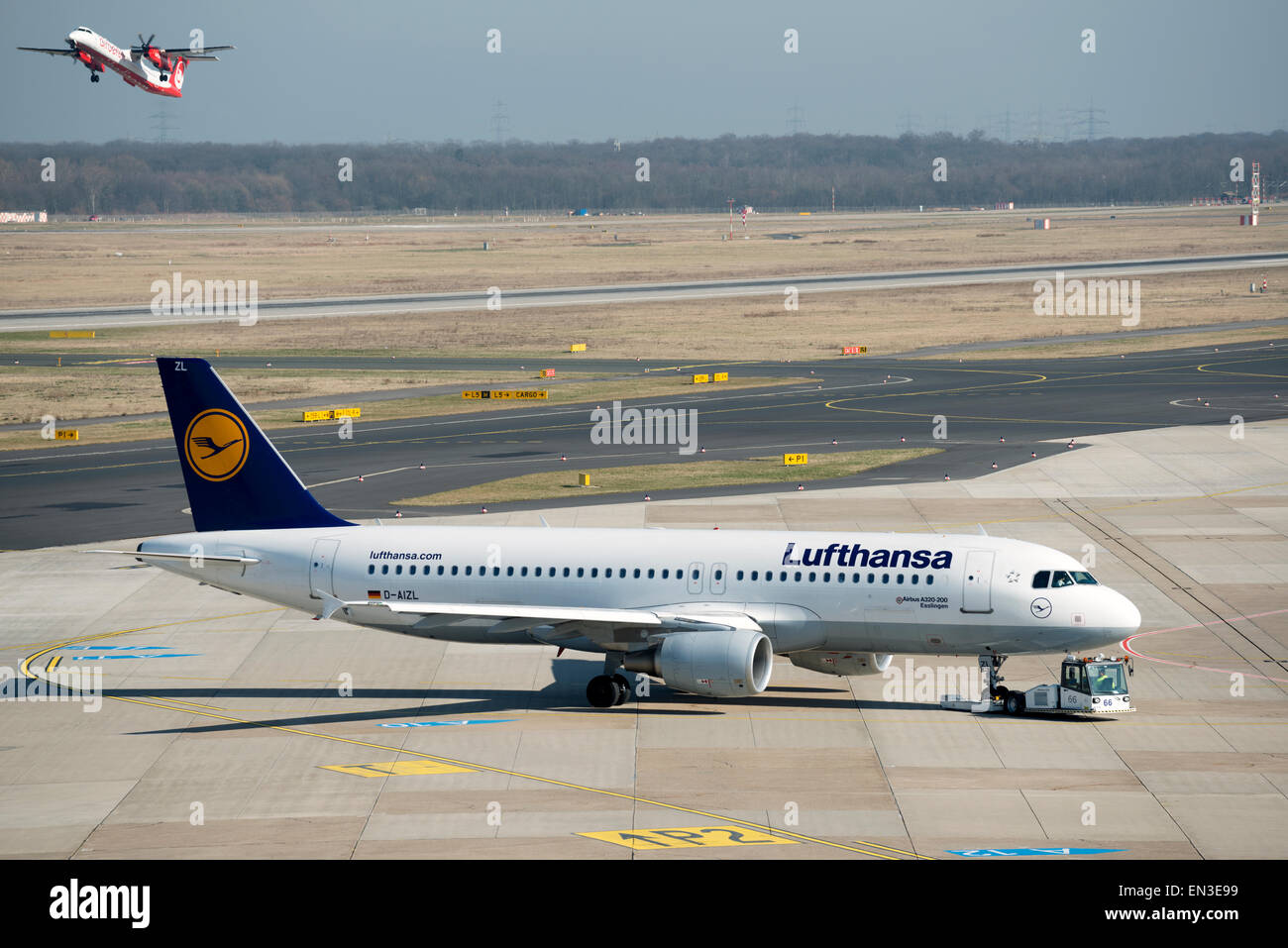 Lufthansa Airbus A320-200 Esslingen being pushed-back by a tug at Dusseldorf International airport Germany Stock Photo
