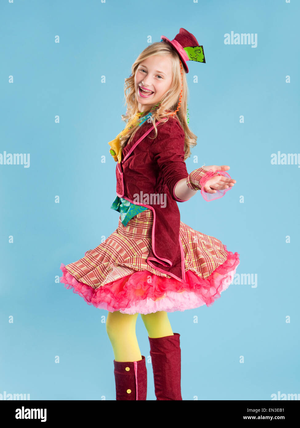 Portrait of girl (10-11) in Mad Hatter costume for Halloween Stock Photo
