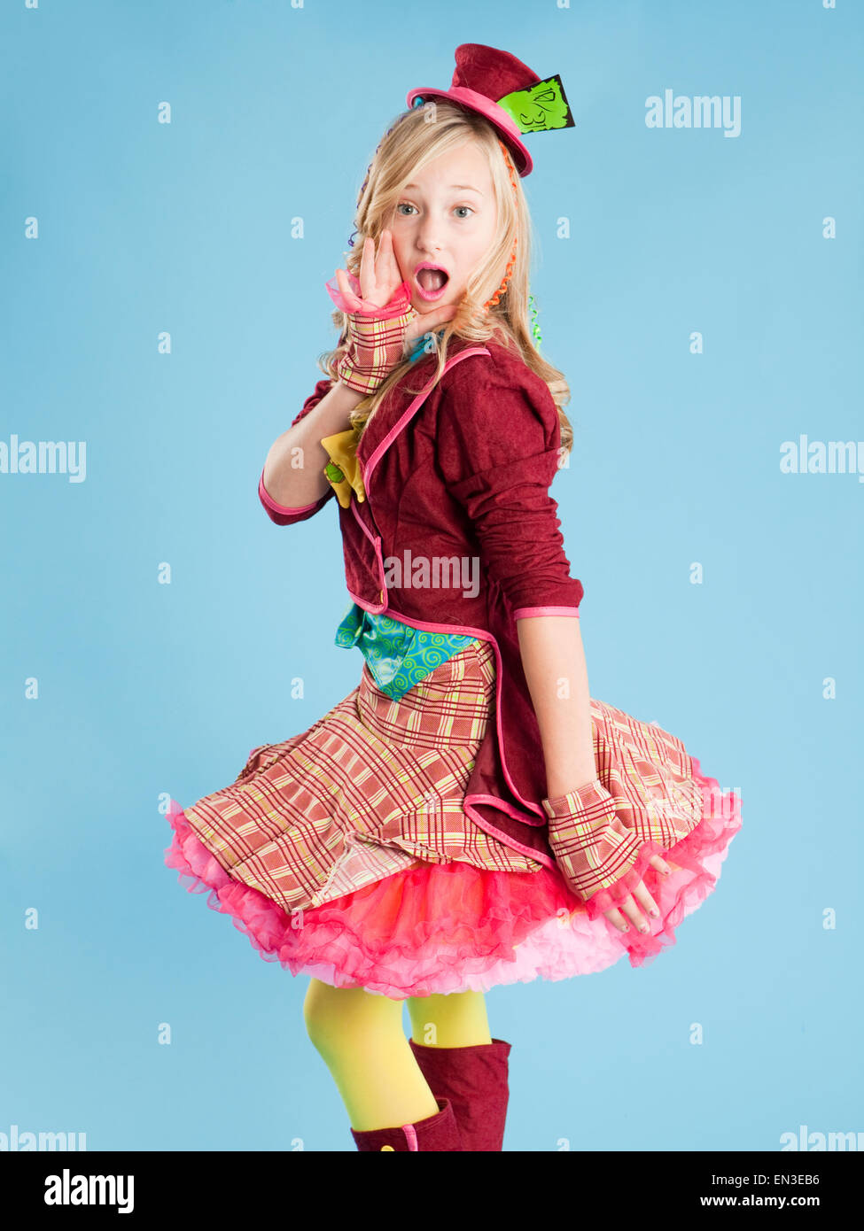 Portrait of girl (10-11) in Mad Hatter costume for Halloween Stock Photo