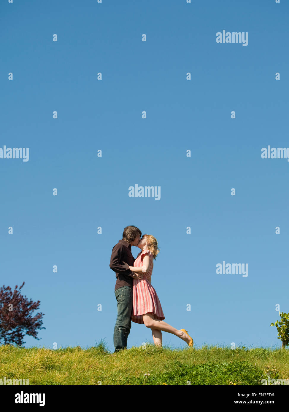 Couple kissing on hill hi-res stock photography and images - Alamy