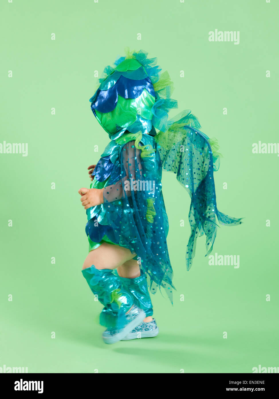 Baby girl (12-17 months) in fish costume for Halloween Stock Photo