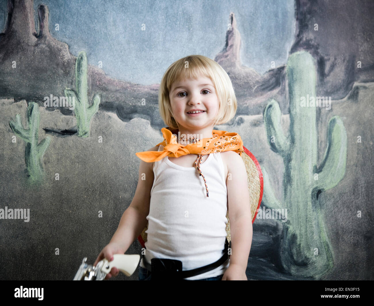 little girl dressing up as a cowgirl Stock Photo