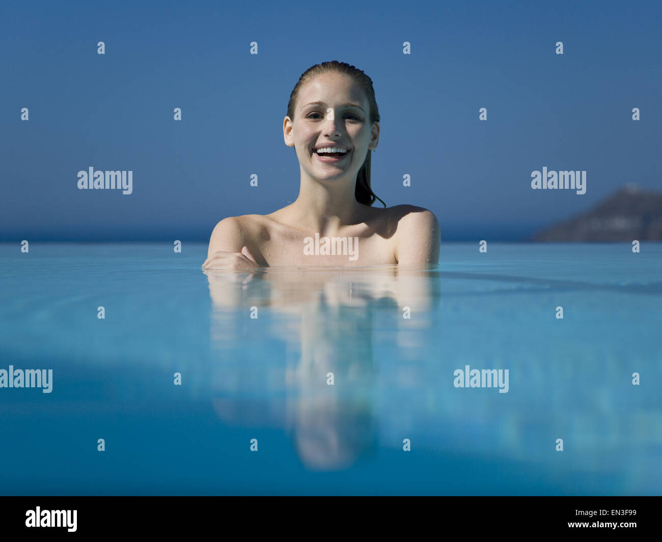 Woman in outdoor pool smiling Stock Photo