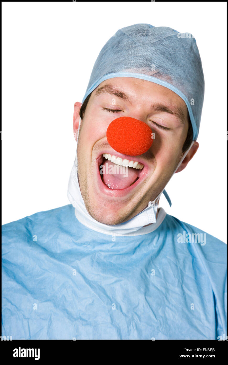 surgeon wearing a creepy clown nose Stock Photo