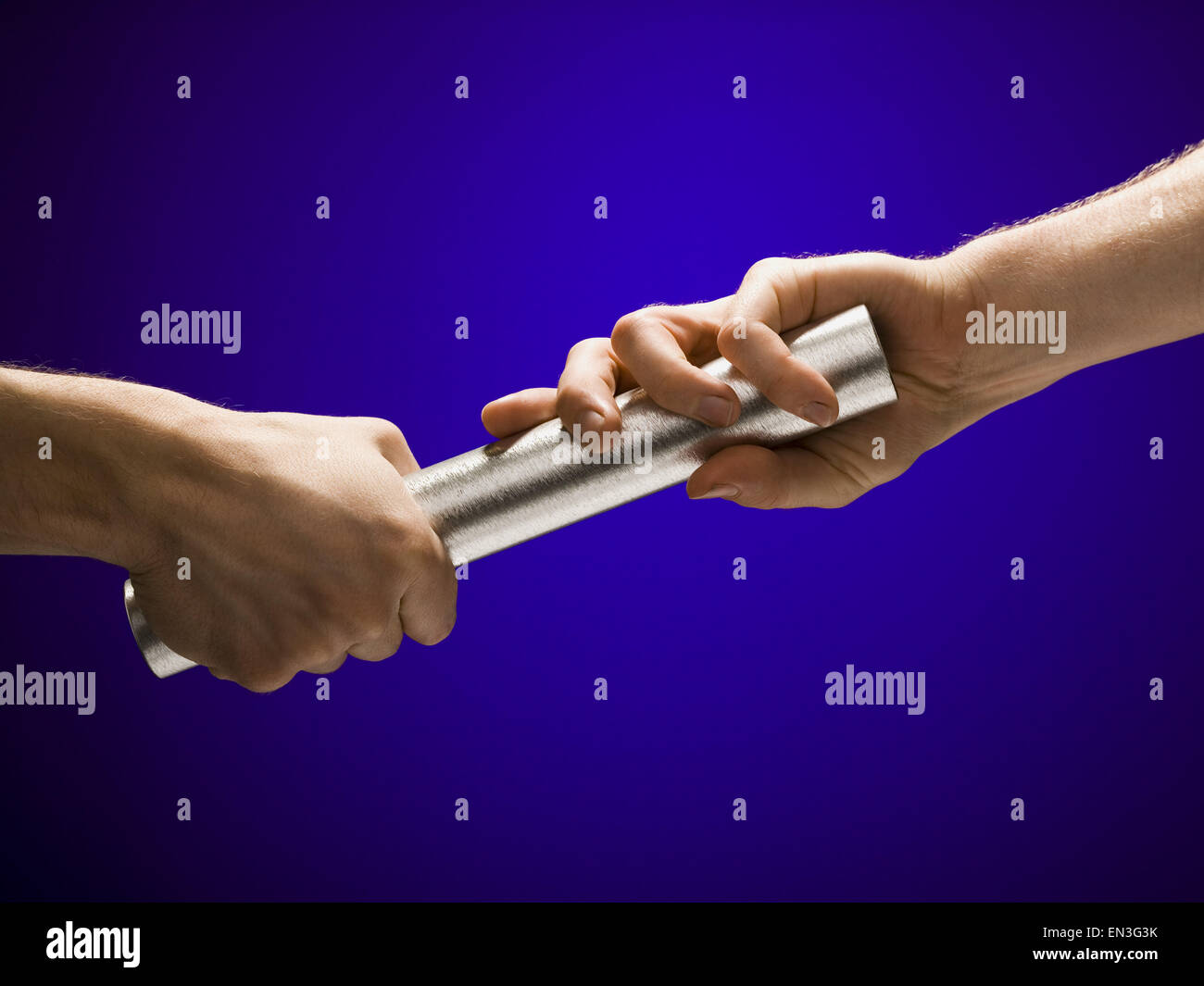 Closeup of relay baton being passed Stock Photo Alamy