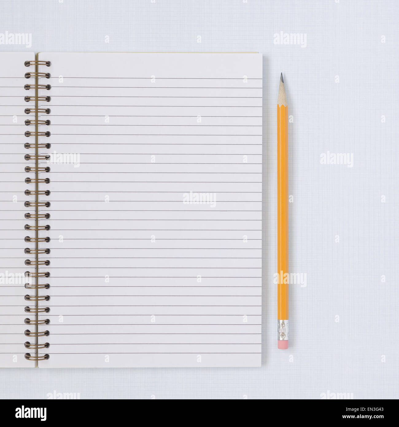 Spiral notebook with pencil and eraser Stock Photo