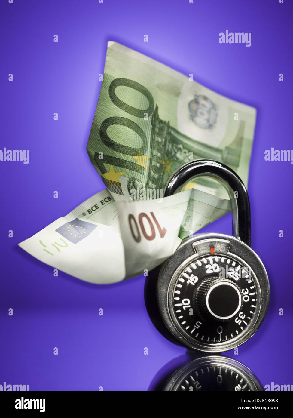 Combination lock with one hundred Euro banknote Stock Photo