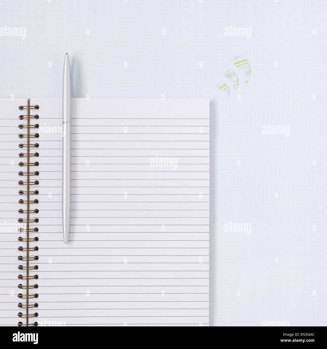 Spiral notebook with pen Stock Photo