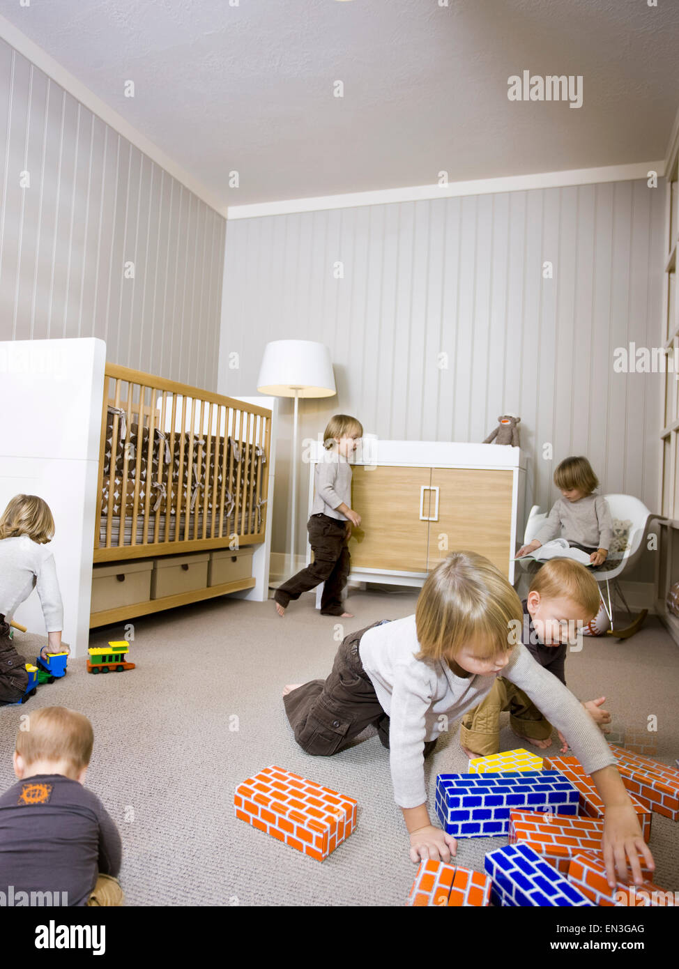 USA,Utah,Provo,Boy (2-3) with baby boy (12-17 months) playing in home Stock Photo