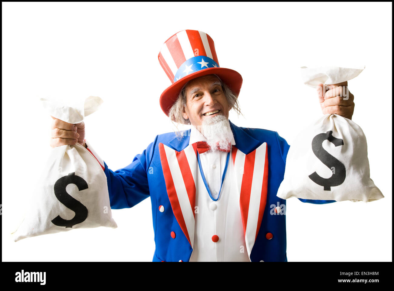 uncle sam holding up two bags of money Stock Photo
