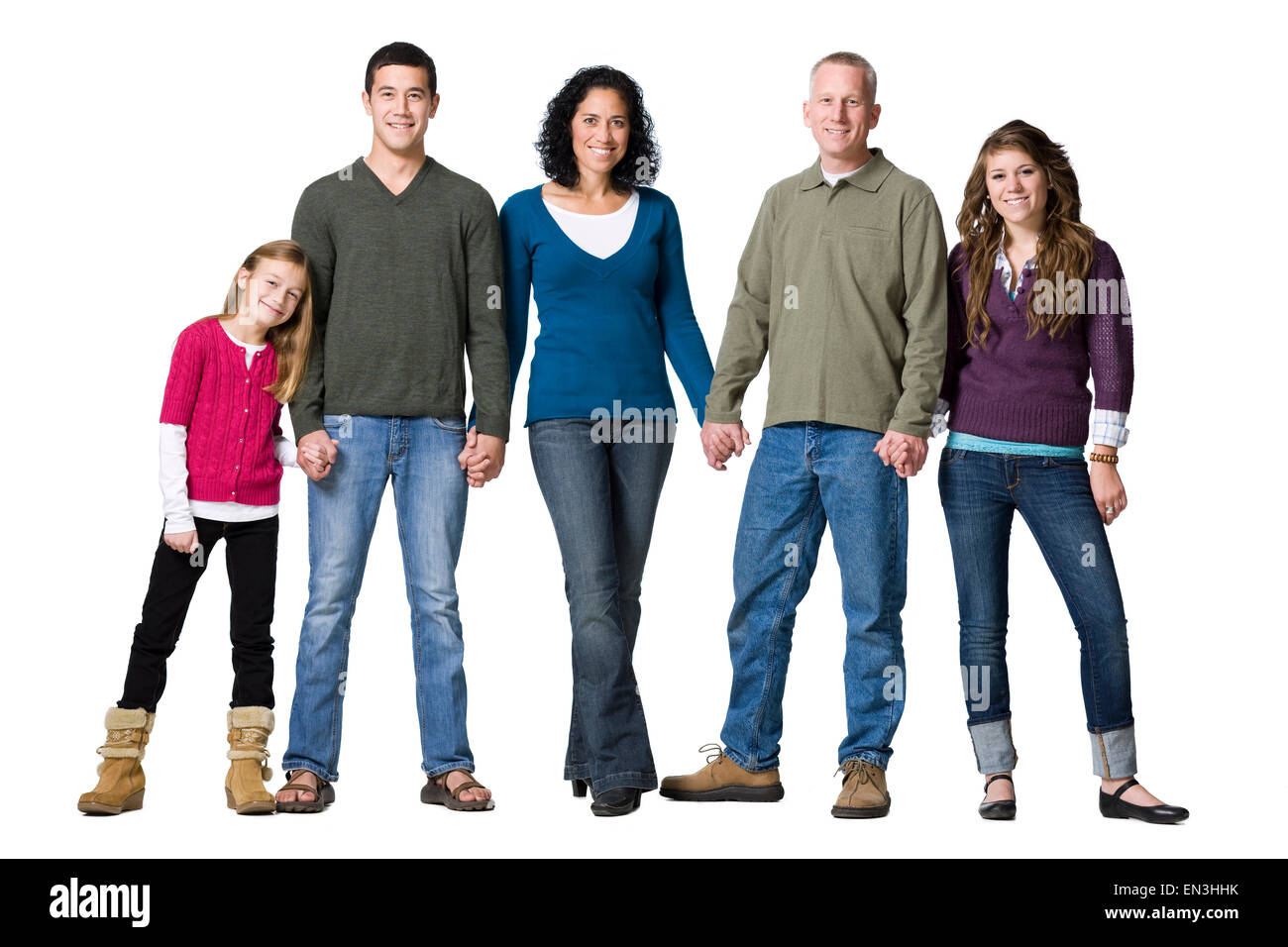 Studio shot of family holding hands Stock Photo