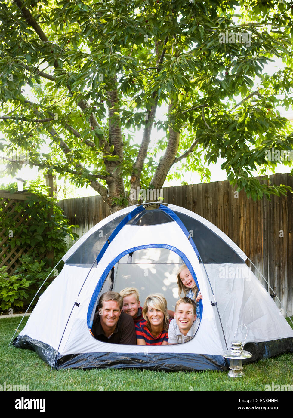 family in a tent in the backyard Stock Photo Alamy