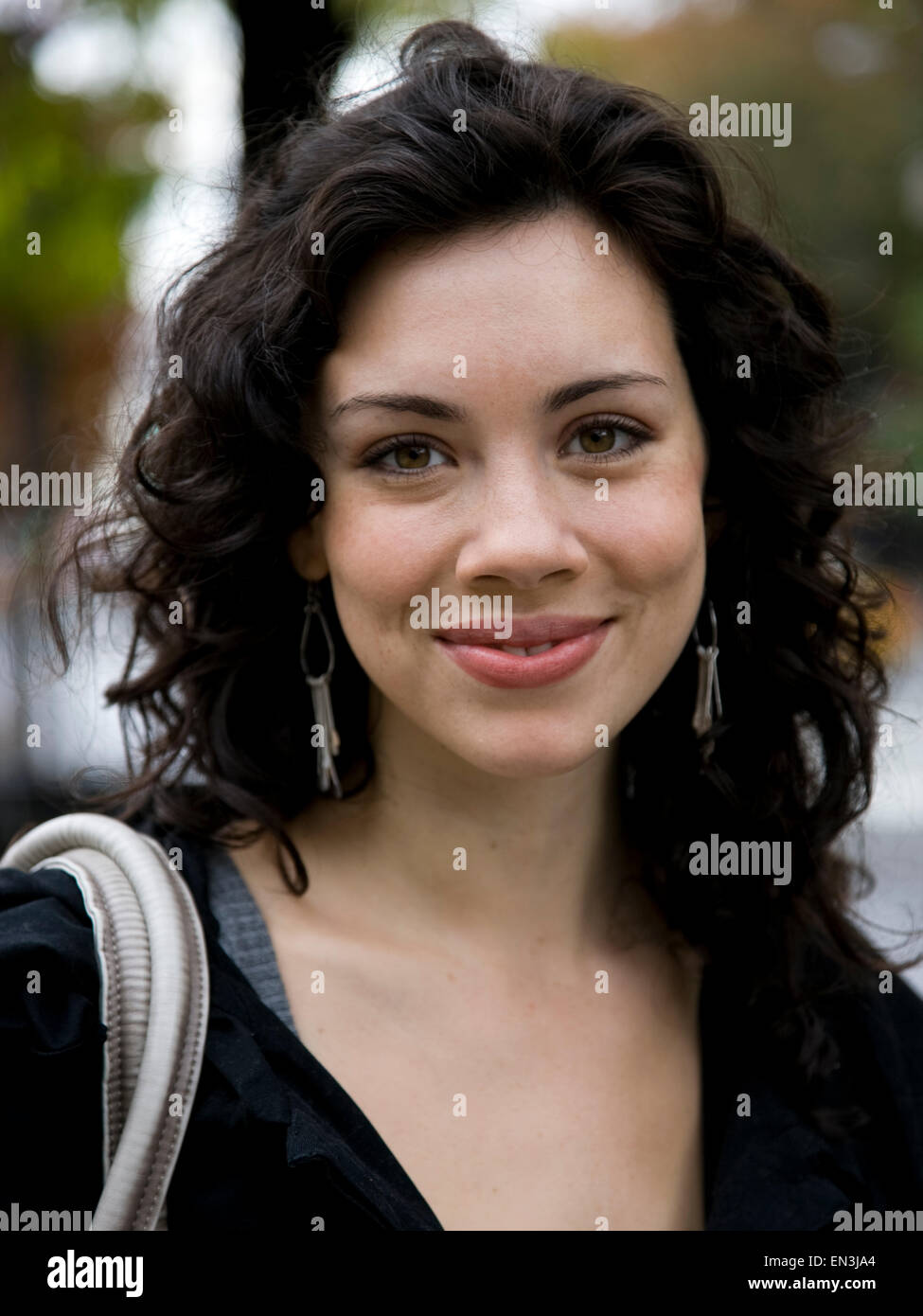 USA, New York, Manhattan, Greenwich Village, Portrait of smiling young woman Stock Photo