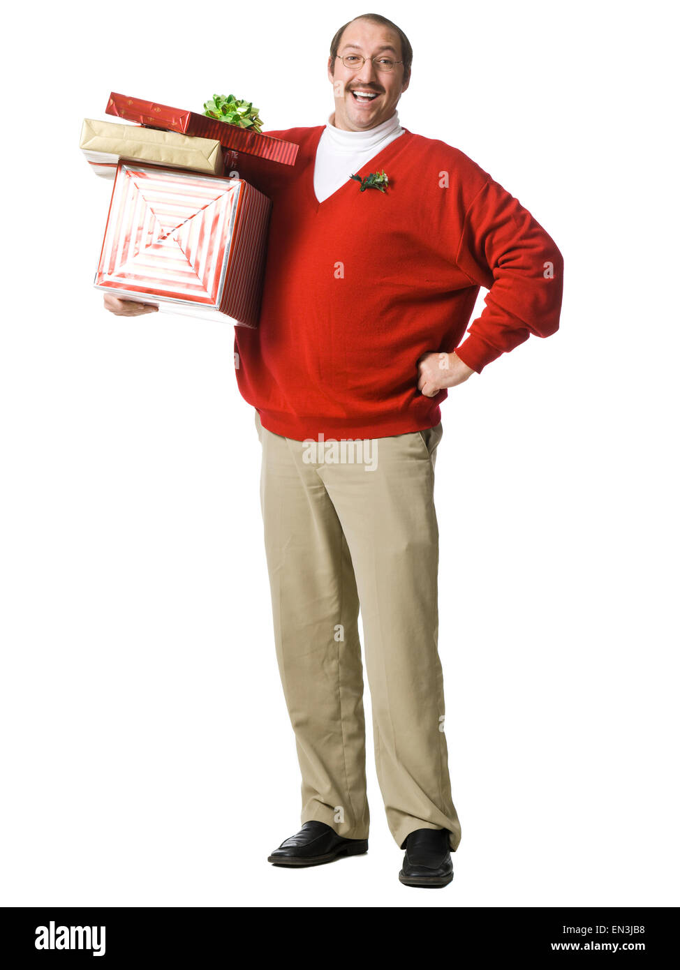 Mid adult man holding gifts Stock Photo