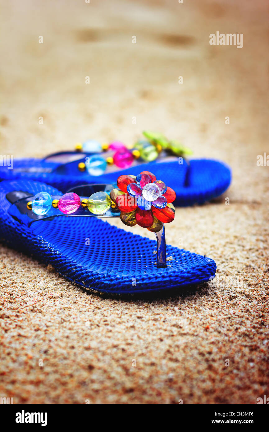 Beach flip flops on tropical sandy coast. Holiday concept Stock Photo ...