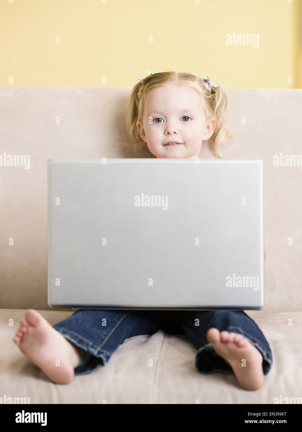 little girl using a laptop Stock Photo - Alamy