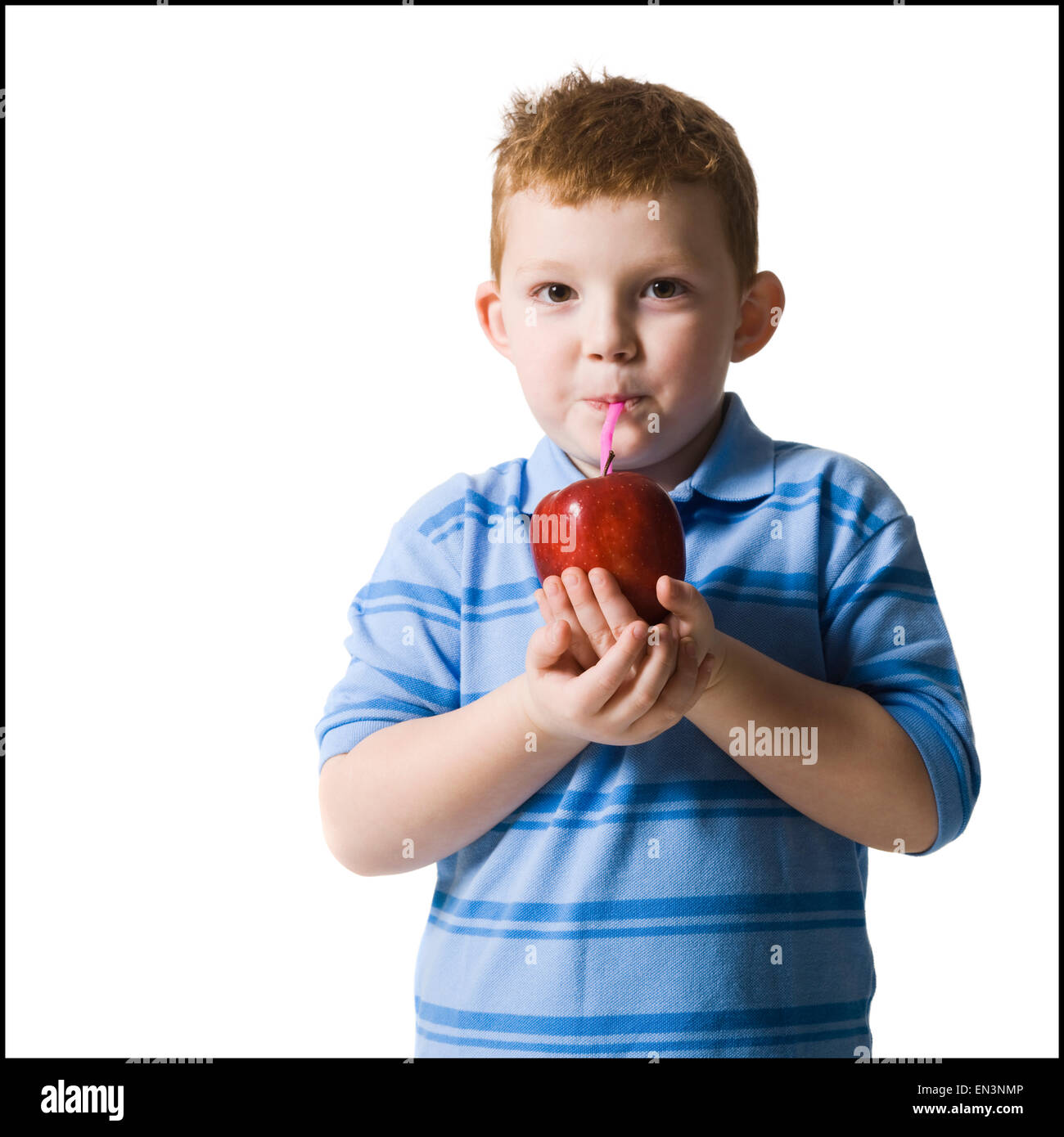 boy drinking an apple with a straw Stock Photo
