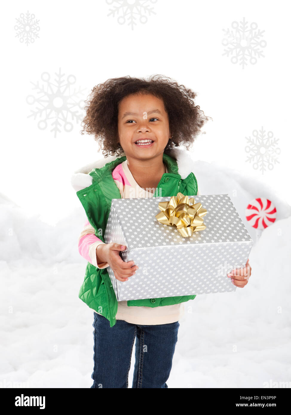 Girl (4-5) holding christmas gift Stock Photo - Alamy
