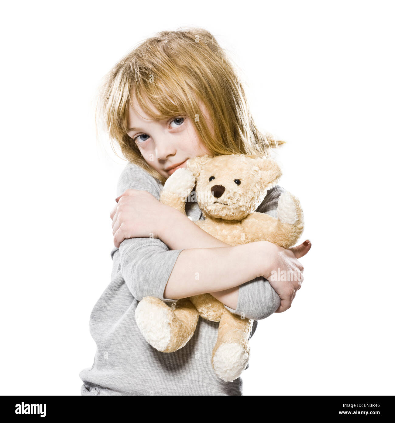 girl hugging her teddy bear Stock Photo - Alamy