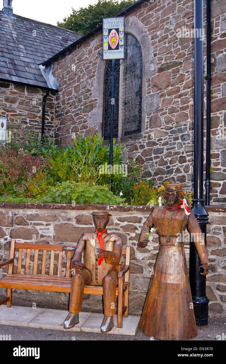 Street art, male and female tinplate metal android robots, St. Cuthbert