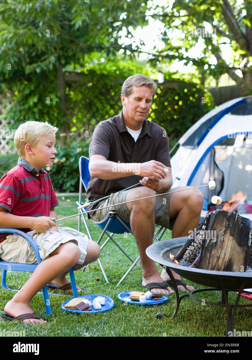 father and son camping in the backyard Stock Photo - Alamy