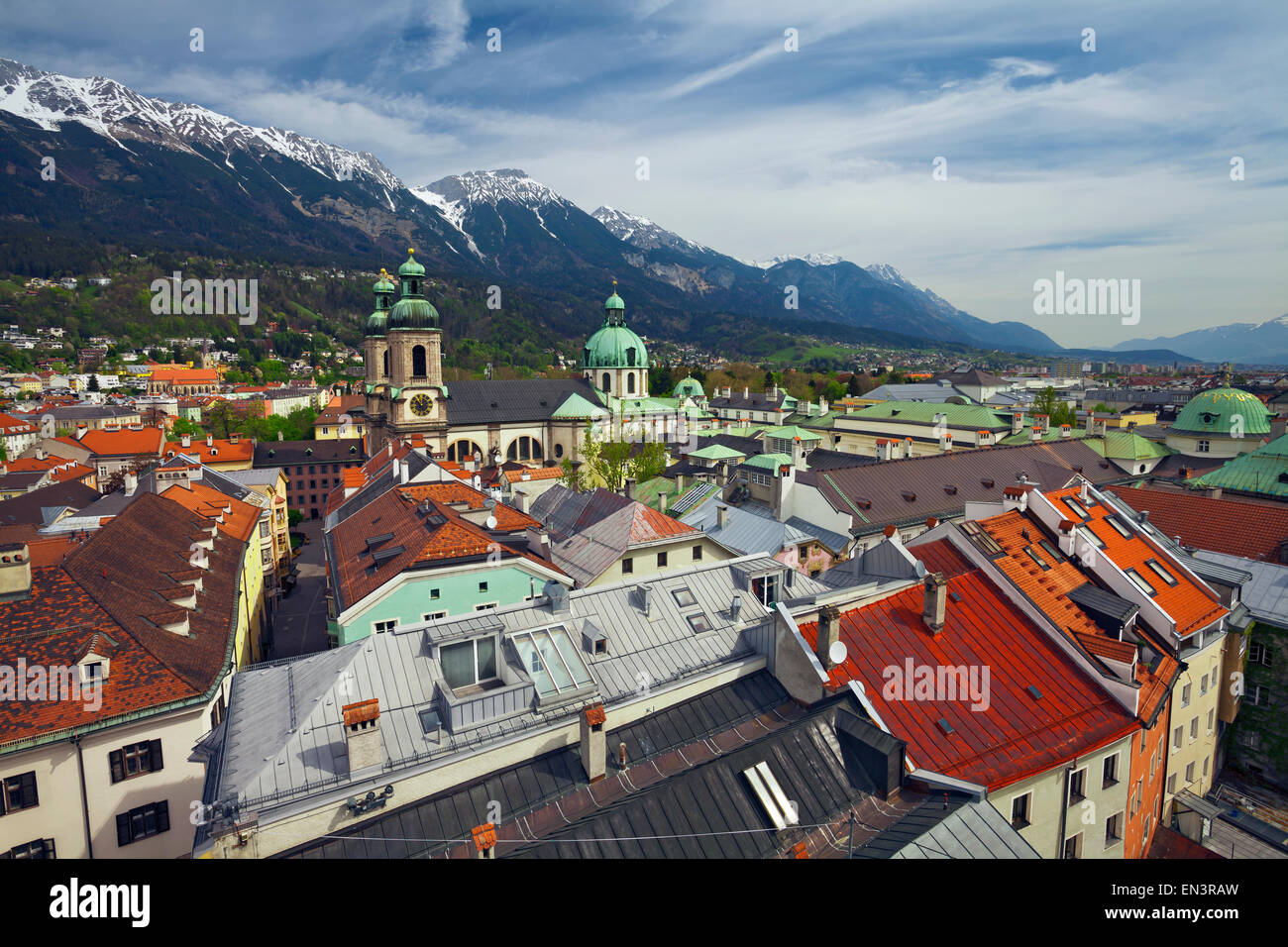 Innsbruck. Aerial view of Innsbruck from the Stadtturm, with the Innsbruck Cathedral (Cathedral of St. James ) and European Alps Stock Photo