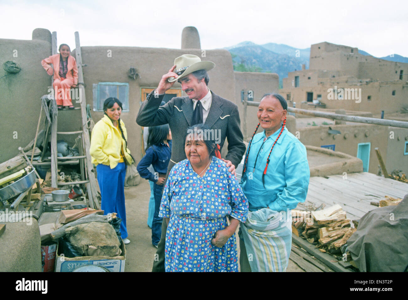 Movie and television star 'Dennis Weaver visiting Taos Pueblo and a Taos Indian family to promote his new TV series McCloud. Stock Photo