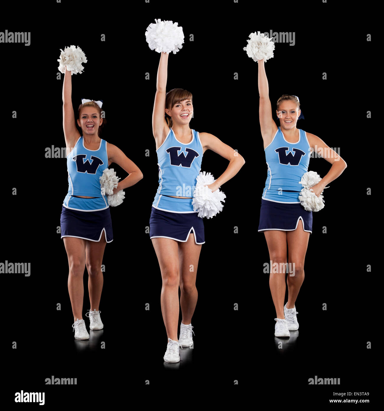Studio shot of cheerleaders (16-17) dancing Stock Photo