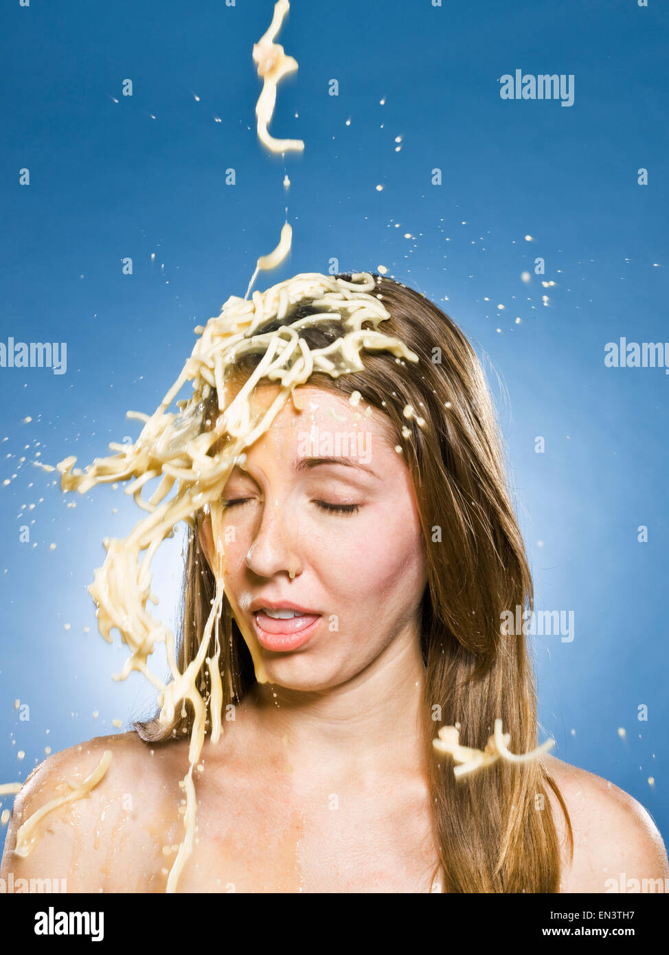 woman getting chicken noodle soup dumped on her head Stock Photo Alamy