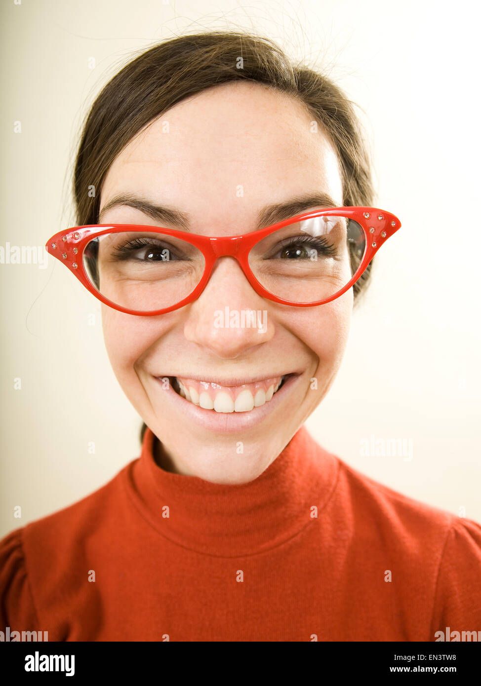 woman smiling wearing horn rimmed glasses Stock Photo