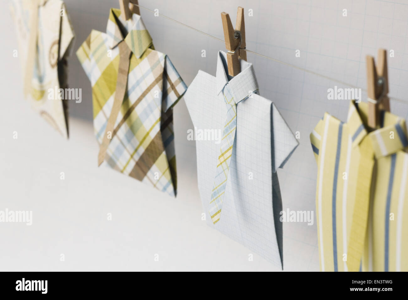 Dress shirts on clothesline with clothes pegs Stock Photo