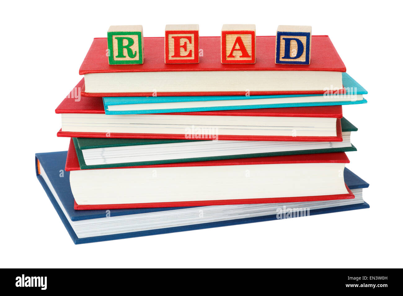 Stack of generic hardback books with word READ spelt with letter blocks on top of a book pile to illustrate a reading concept isolated on white. UK Stock Photo