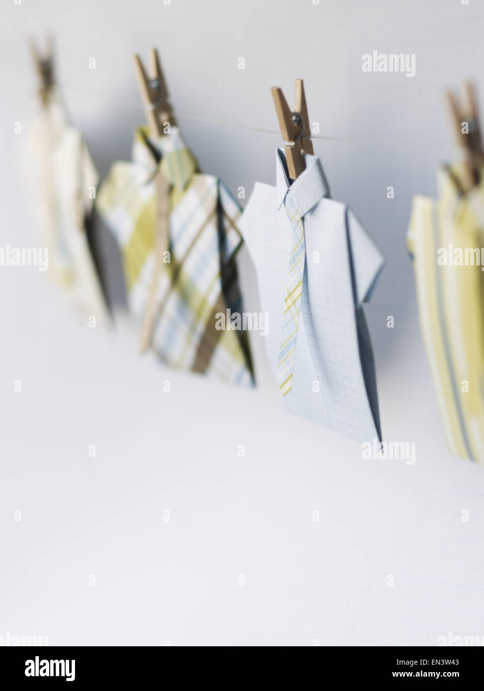 Dress shirts on clothesline with clothes pegs Stock Photo
