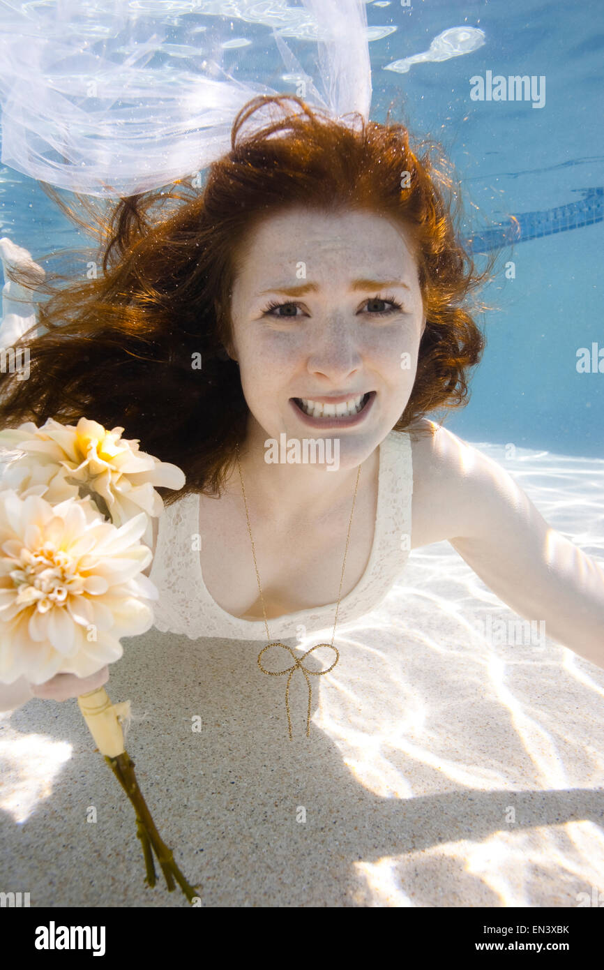 USA, Utah, Orem, Portrait of young bride with bouquet under water Stock ...