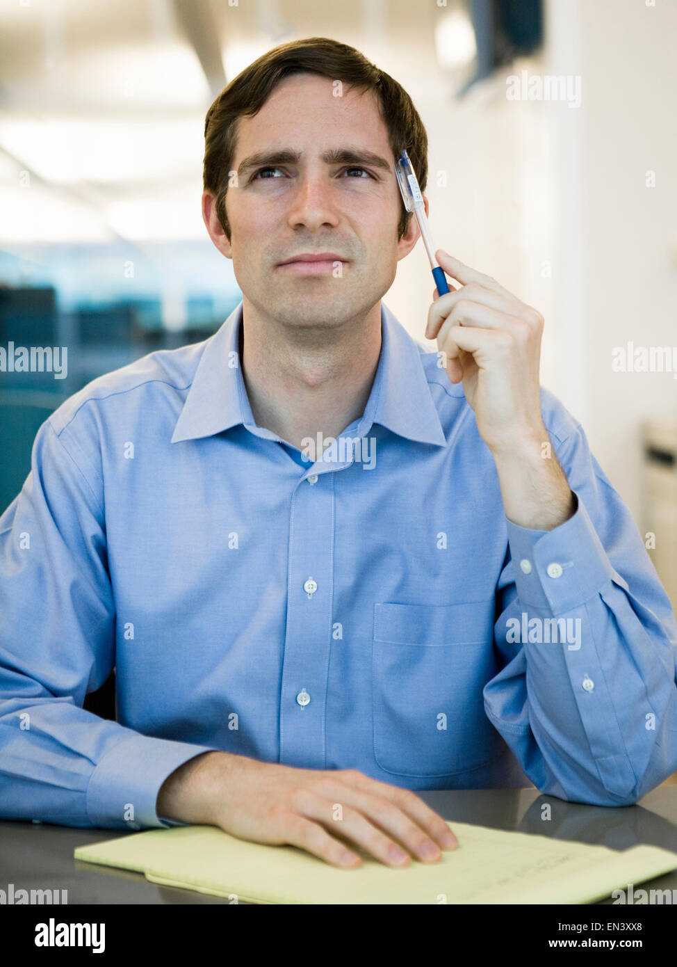 man in a blue shirt at work Stock Photo
